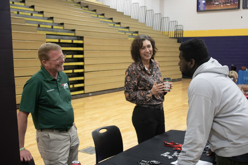 CHS student talks to business representatives at recent career fair.