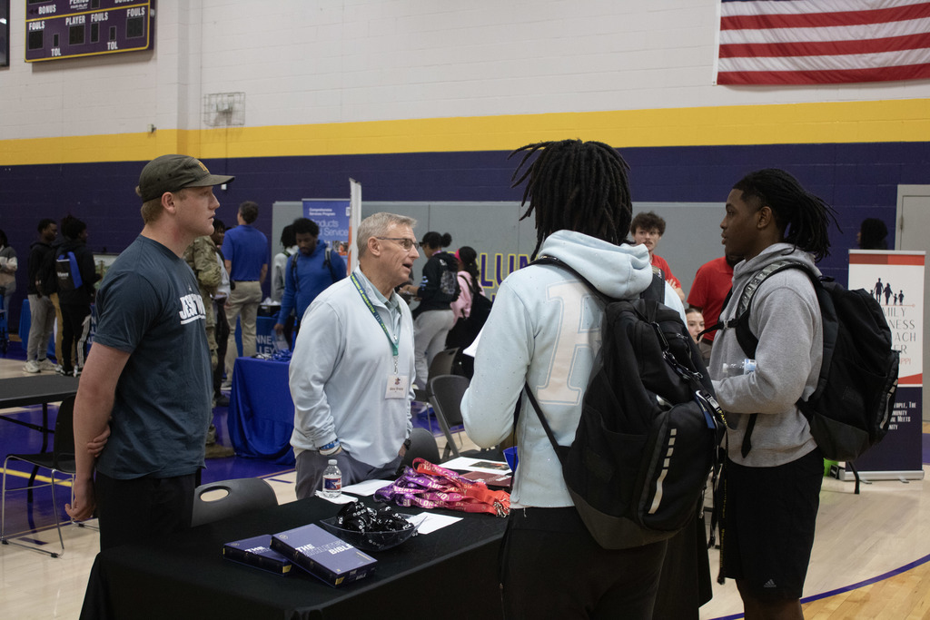 CHS students talk with a business representative at the school's career fair.