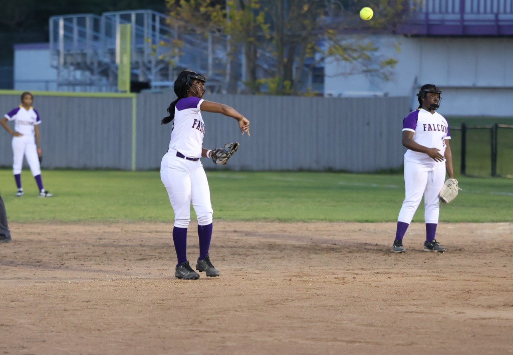 CHS softball player throws the ball. 