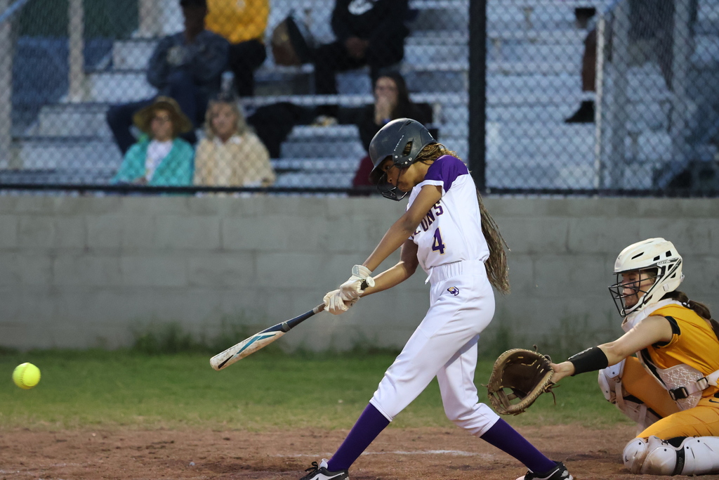 CHS softball player swings at a pitch. 