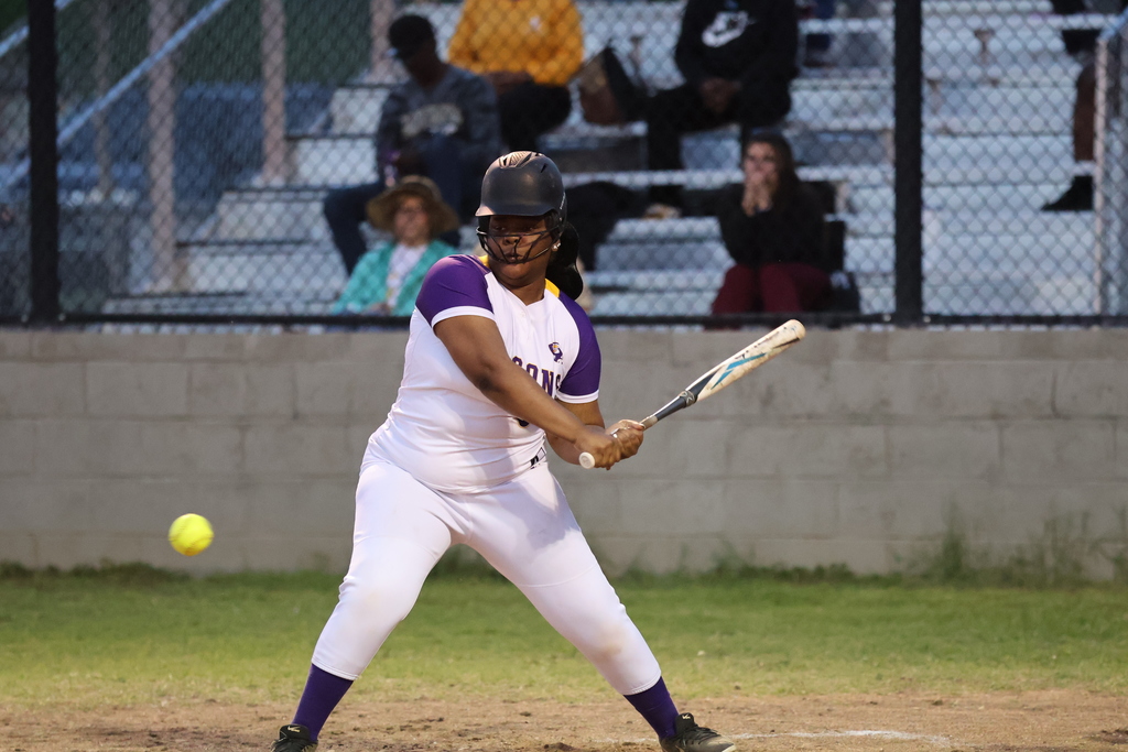 CHS softball player at bat looks at a pitch