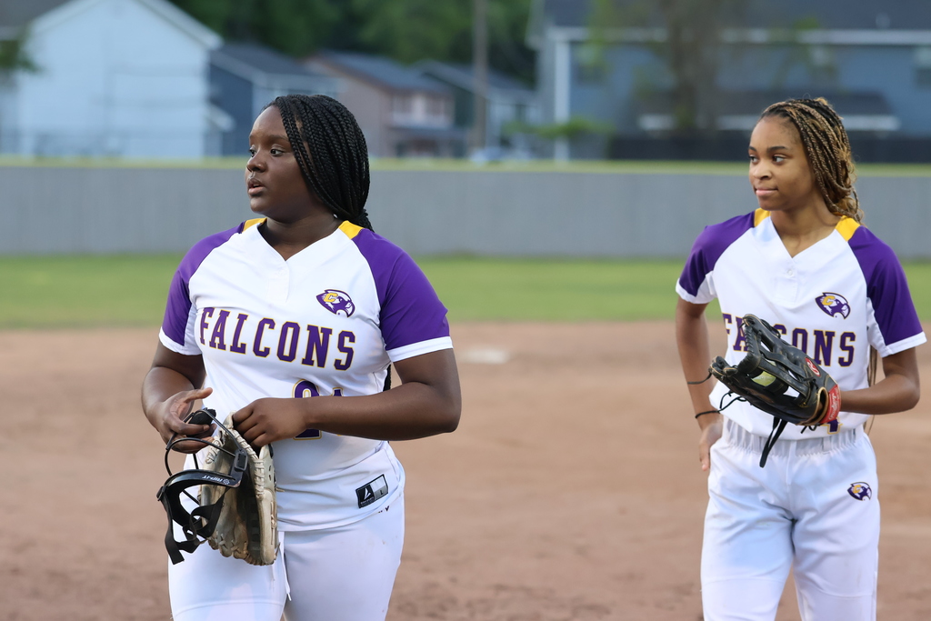 CHS softball players walk off the field. 