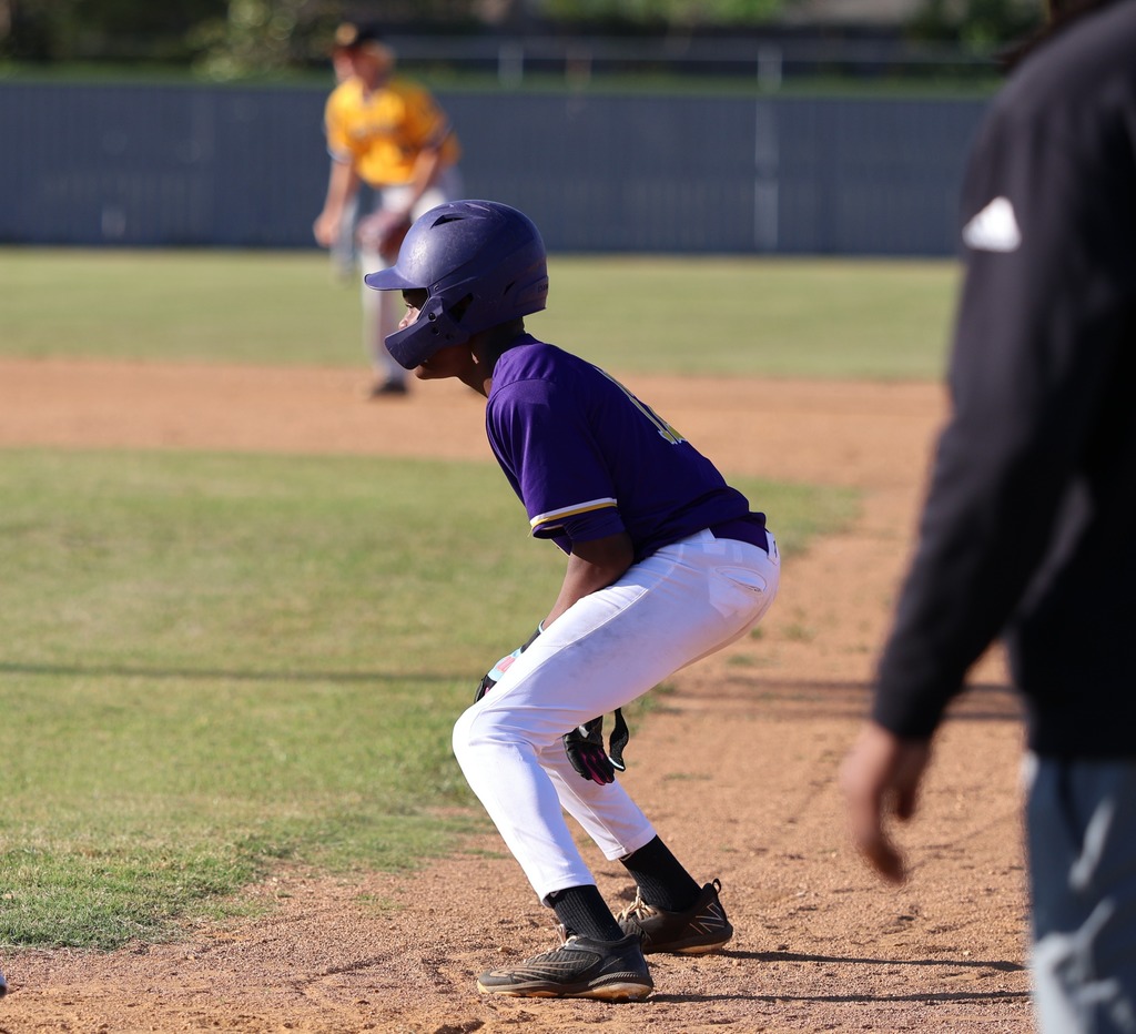 A CHS baseball player stands just off first base. 