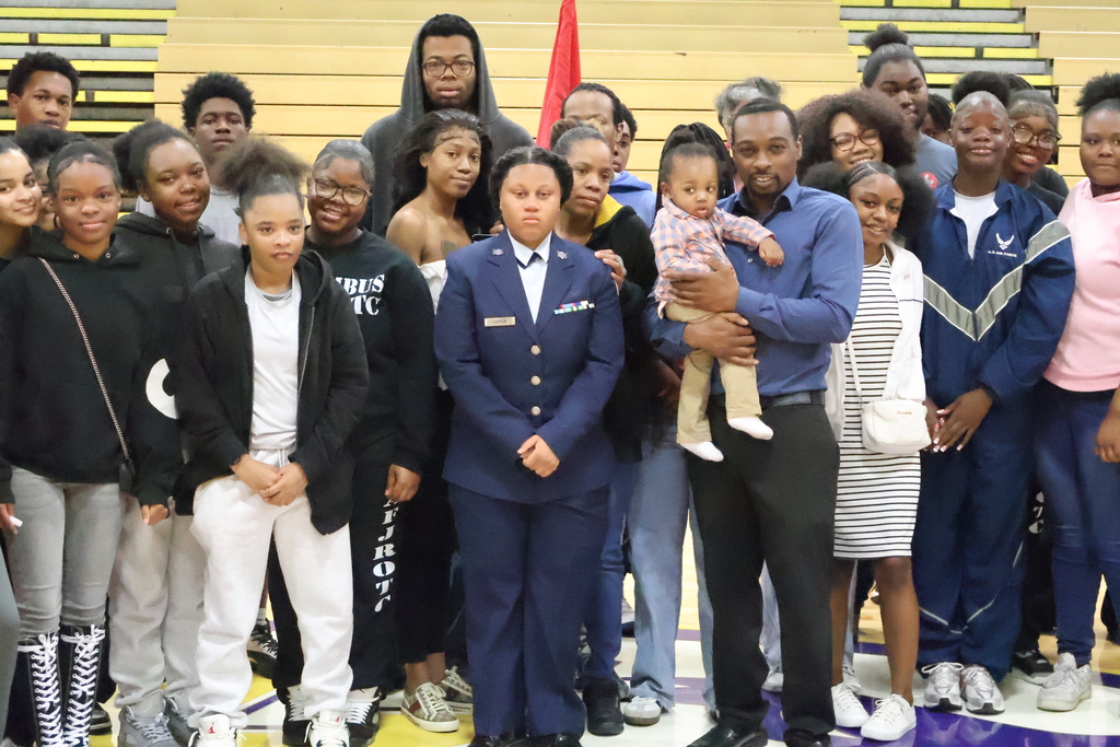 Friends pose after NiJayhia Capron's enlistment ceremony