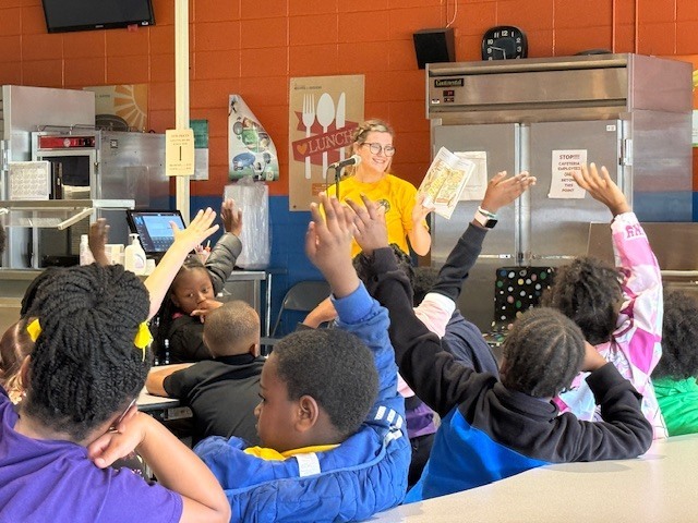 Members of the Air Force Sergeants Association Chapter 651 read to Cook Elementary students. 