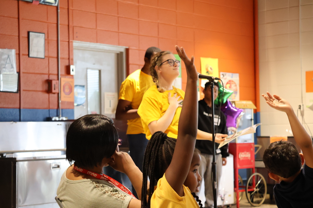 Members of the Air Force Sergeants Association Chapter 651 talk to Cook Elementary students. 
