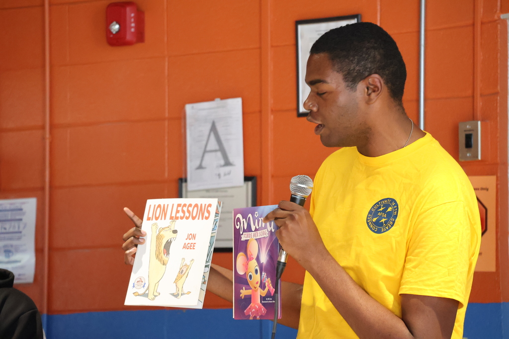 Members of the Air Force Sergeants Association Chapter 651 read to Cook Elementary students. 