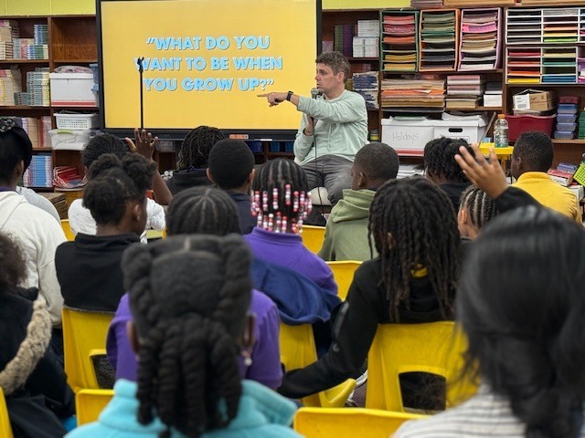 Cook Elementary students ask author Max Brallier questions. 