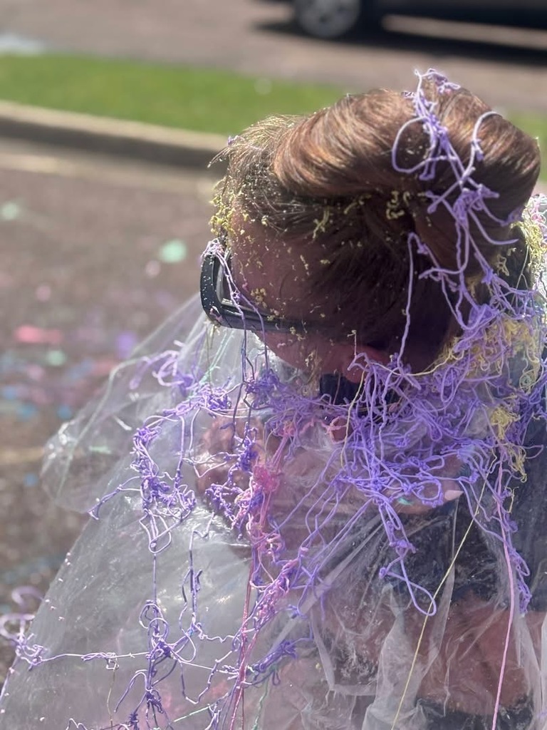 A Stokes Beard Elementary teacher covered in silly string.
