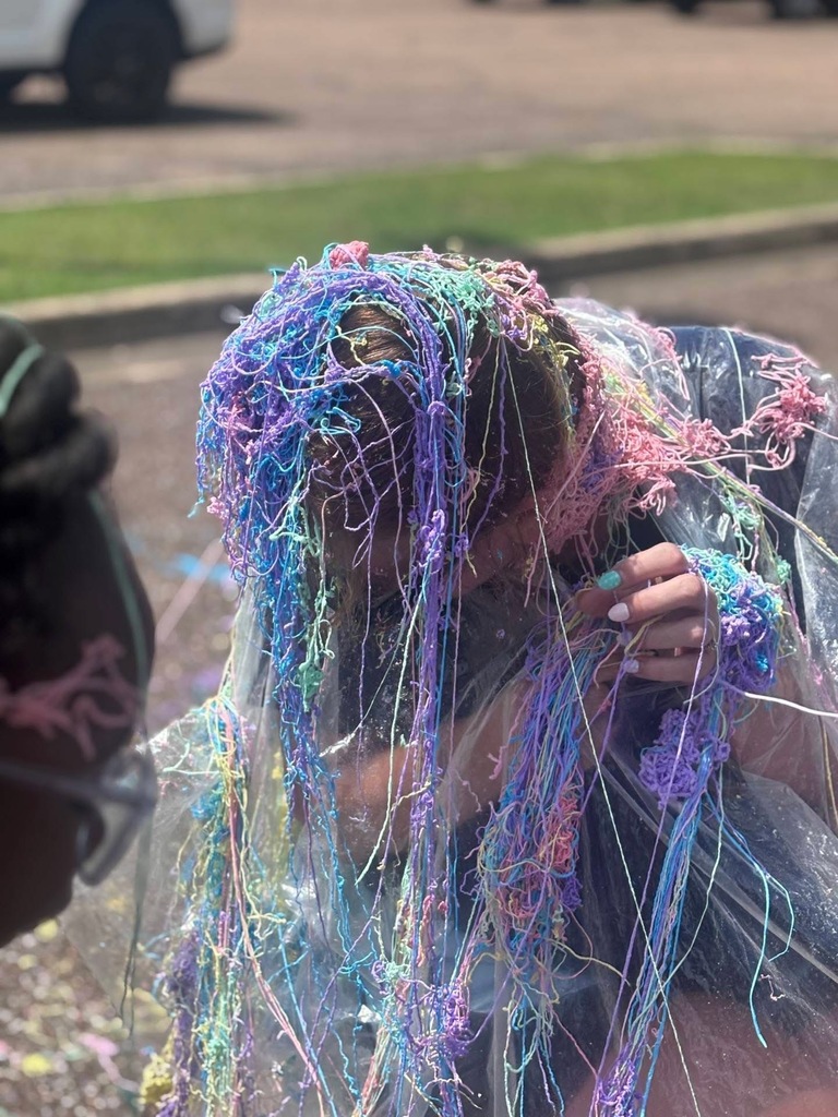 A Stokes Beard Elementary teacher covered in silly string.