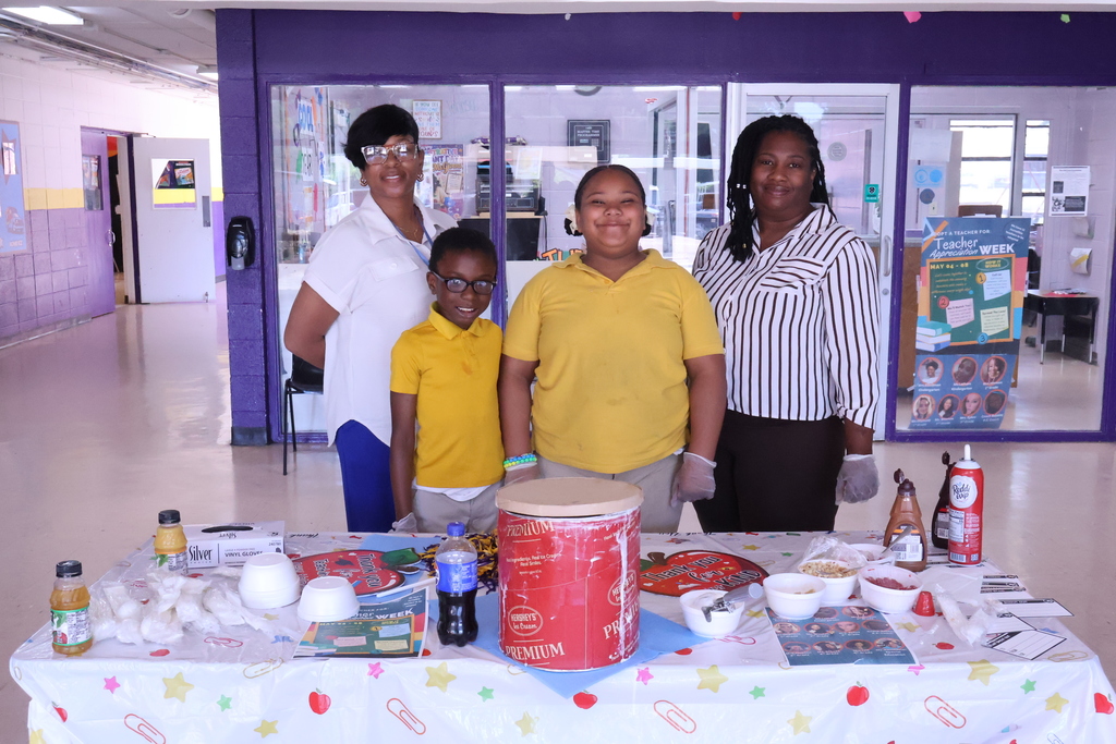 Students at Fairview Elementary help serve ice cream to their teachers.