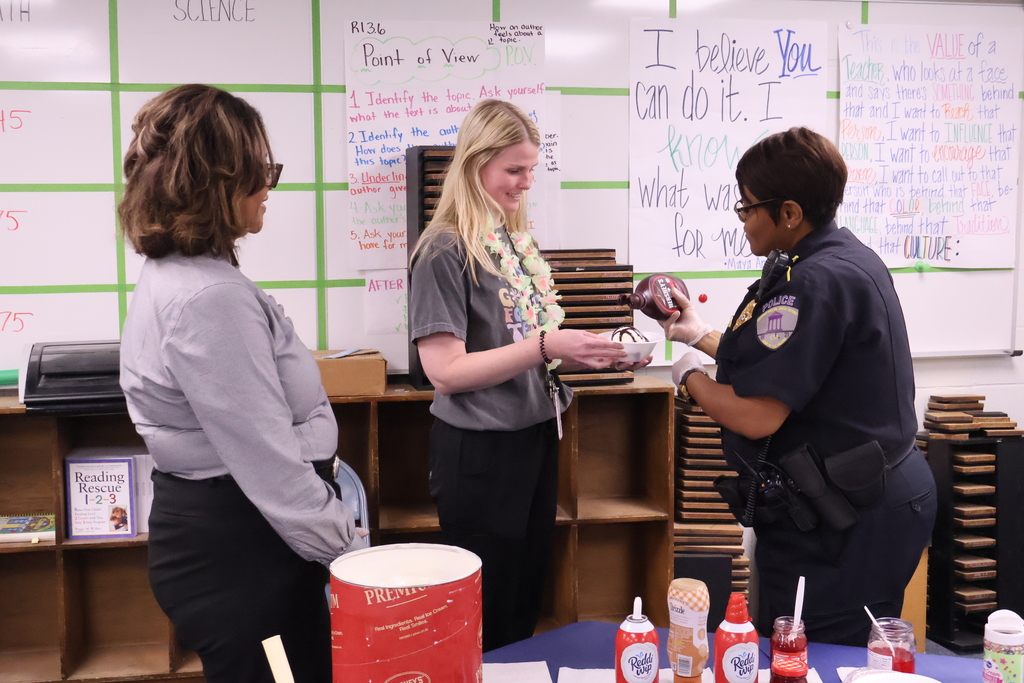 Central office staff serve teachers at Sale Elementary ice cream. 