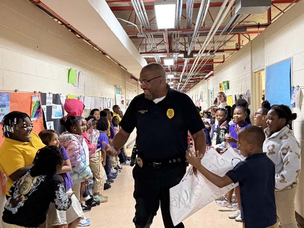 Columbus Police Chief Joseph Daughtry greets Fairview Elementary students during the "No Crumbs" celebration before state testing.