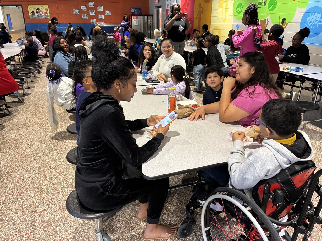 Students at Cook Elementary enjoy "Muffins with Mom" on Friday morning. 