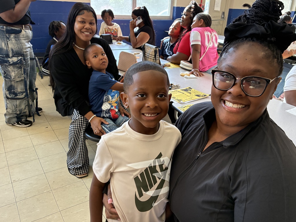 Mothers and students enjoy cookies at a "Cookies with Mom" event at Sale Elementary on Friday morning.