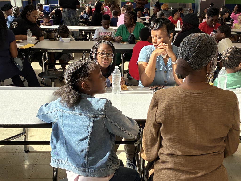 Mothers and students enjoy cookies at a "Cookies with Mom" event at Sale Elementary on Friday morning.