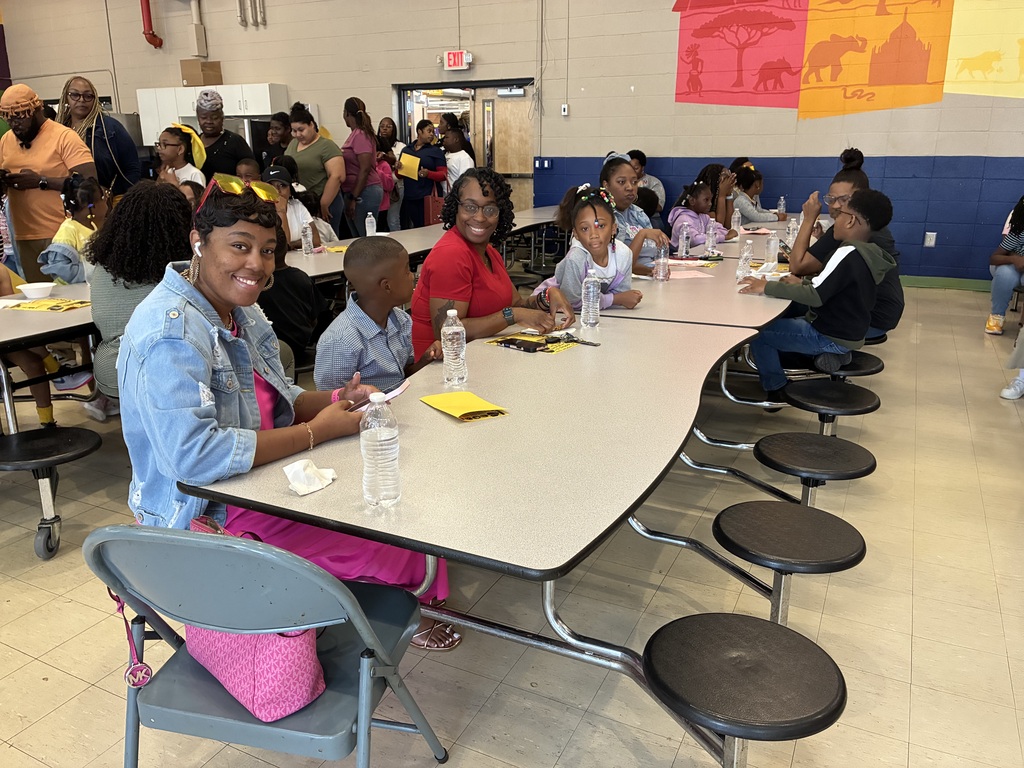 Mothers and students enjoy cookies at a "Cookies with Mom" event at Sale Elementary on Friday morning.
