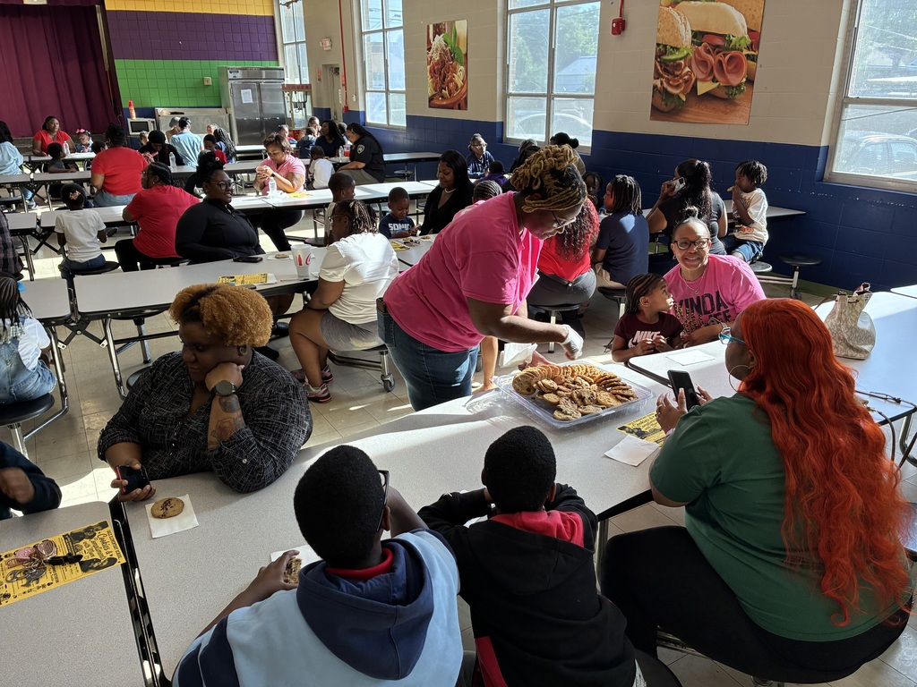 Mothers and students enjoy cookies at a "Cookies with Mom" event at Sale Elementary on Friday morning.