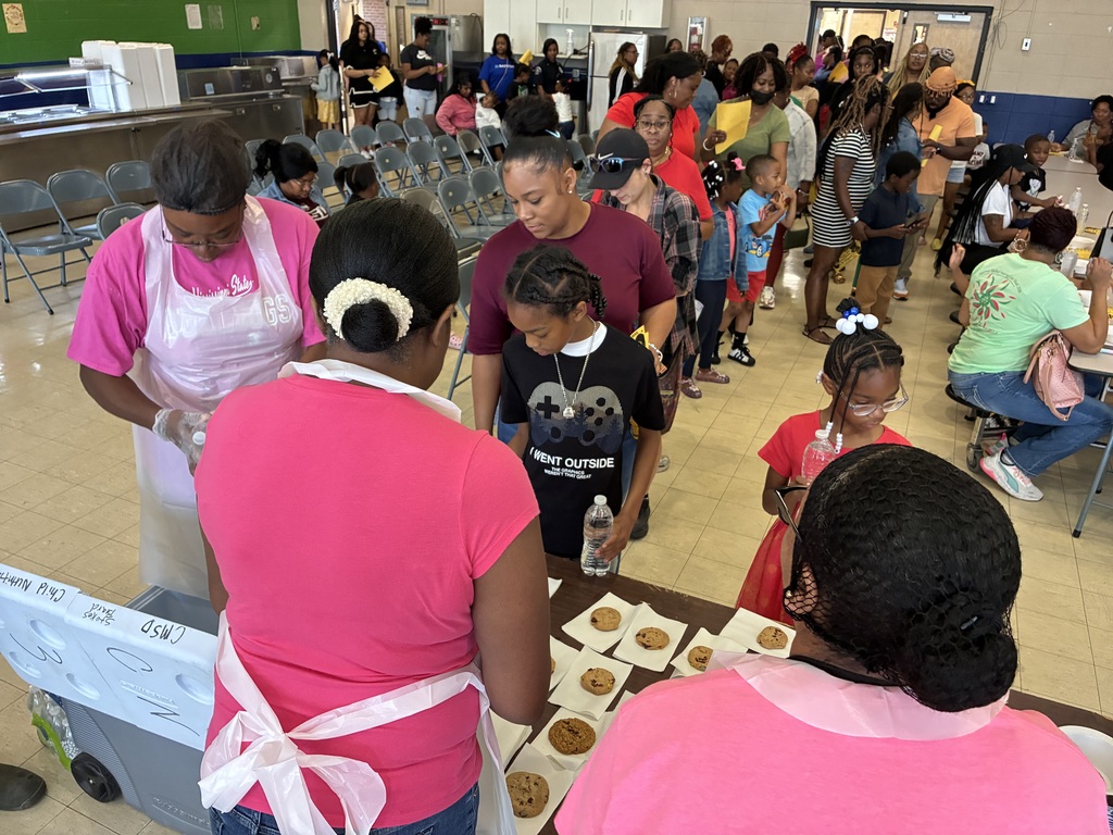 Mothers and students enjoy cookies at a "Cookies with Mom" event at Sale Elementary on Friday morning.