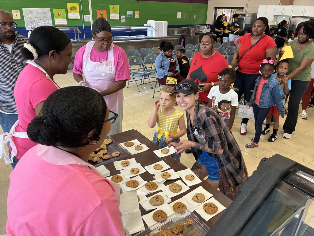 Mothers and students enjoy cookies at a "Cookies with Mom" event at Sale Elementary on Friday morning.