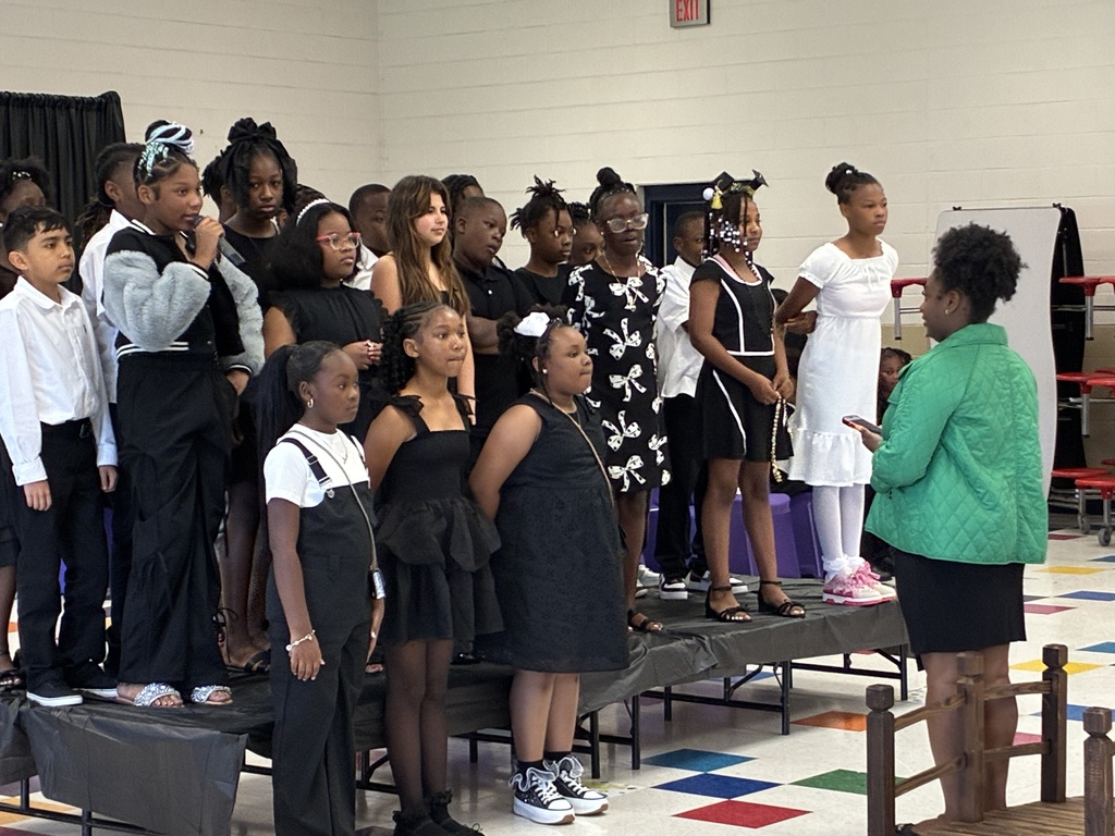Students sing at Stokes Beard Elementary where 4th graders were recognized at a Bridge Crossing Awards Day event on Monday morning.