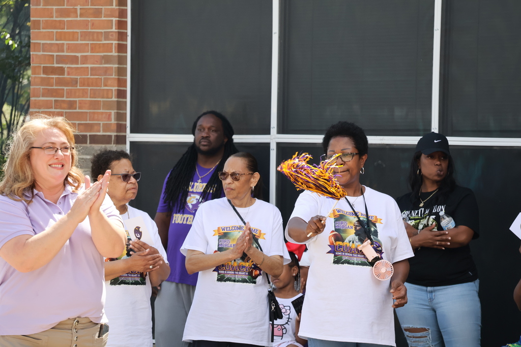 People cheer on a speaker at the "Meet the Coach" event this past Saturday at Columbus High.