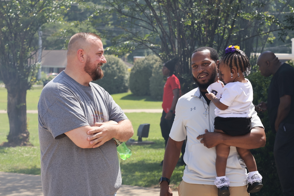 Coach Morgan speaks to a CHS alumni at the event.