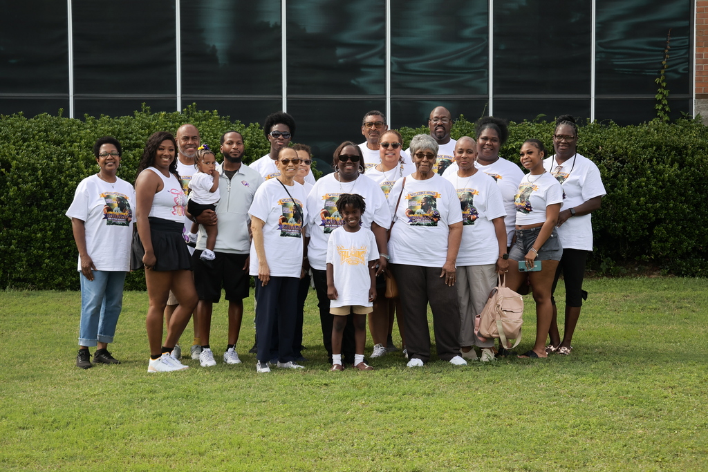 Coach Morgan and his family pose for a picture during the "Meet the Coach" event.