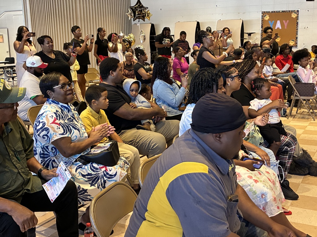 Parents and family watch their students during the Fairview Elementary Kindergarten Graduation ceremony.
