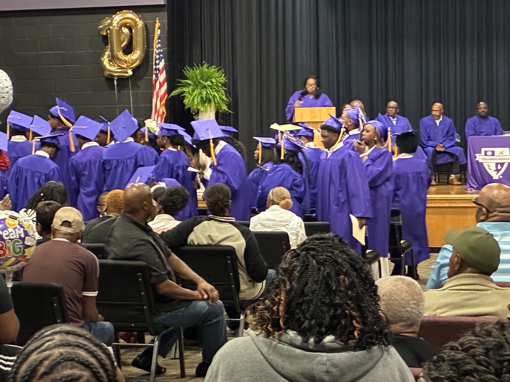 Columbus Middle School hosted its 8th grade graduation ceremony on Friday afternoon. Students stand to go on stage.