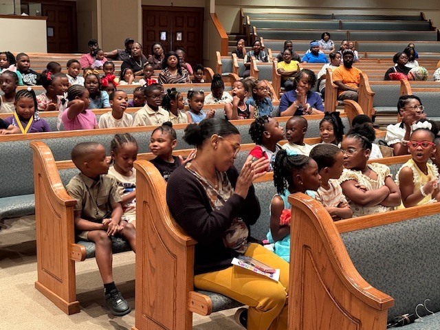 Students cheer on their classmates at Fairview Elementary's  Awards Day Ceremony on Wednesday morning.