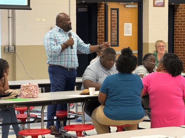 Dr. Chapman talks to teachers at Stokes-Beard Elementary