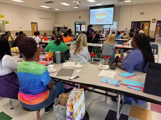 Teachers introduce themselves at to other educators at Stokes-Beard Elementary. 