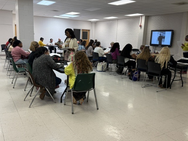 CHS staff gather to congratulate Dr. Andrews on his appointment as Assistant Superintendent. 