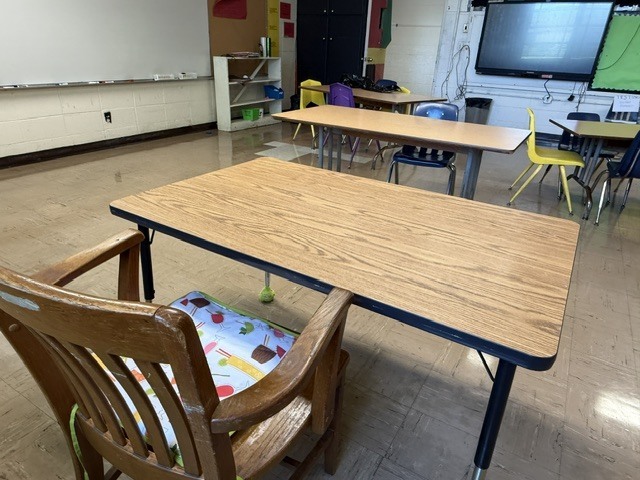 Chairs and a desk in an empty classroom at Fairview Academy. 