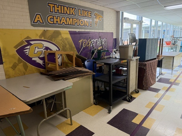 A hallway lined with desks at Columbus High