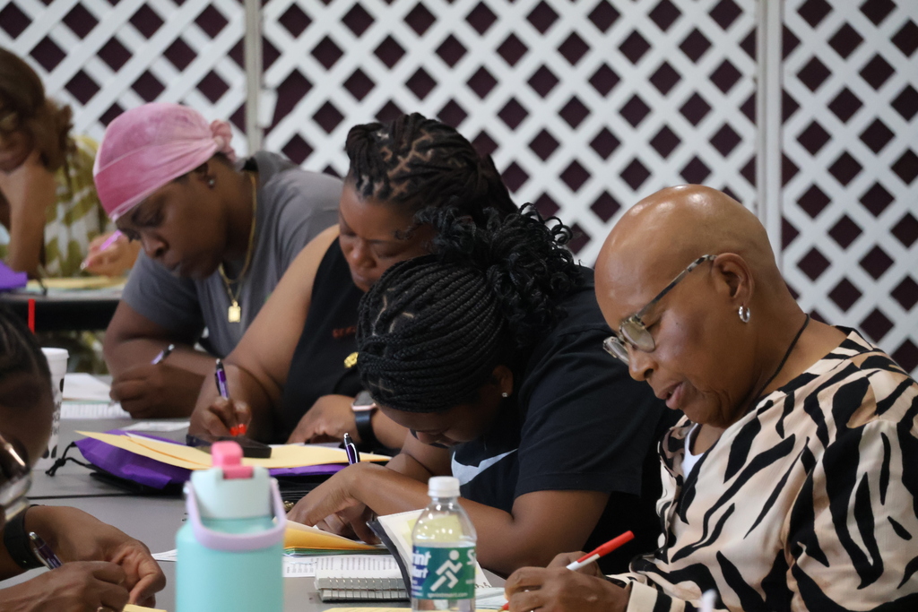 New CMSD employees fill out paperwork at the new employee orientation held at Brandon Central Services Center on Friday morning. 