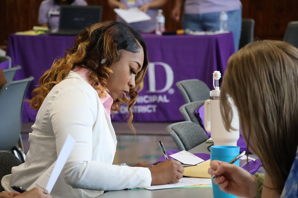 New CMSD employees fill out paperwork at the new employee orientation held at Brandon Central Services Center on Friday morning. 