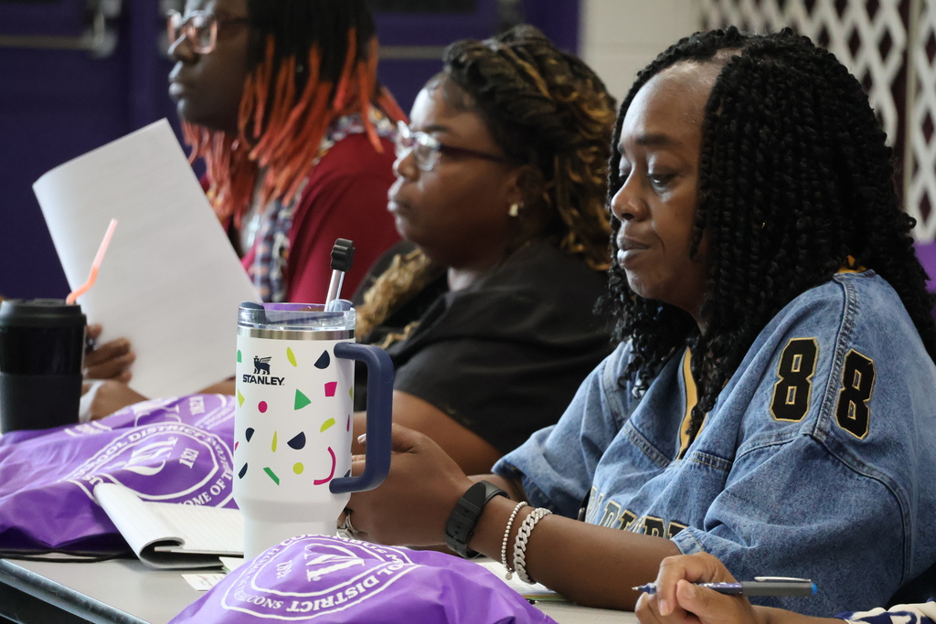 New CMSD employees talk with each other at the new employee orientation held at Brandon Central Services Center on Friday morning. 