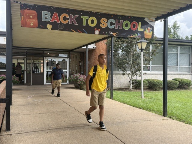 Students walk out of Sale Elementary