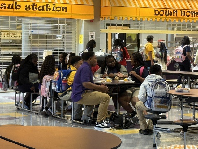 Columbus Middle School students eat breakfast before class begins.