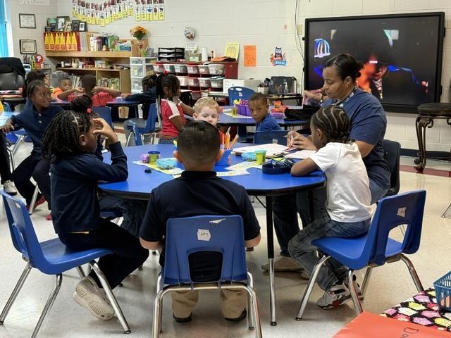 Stokes Beard Elementary students listen to their teacher during a lesson in the classroom.