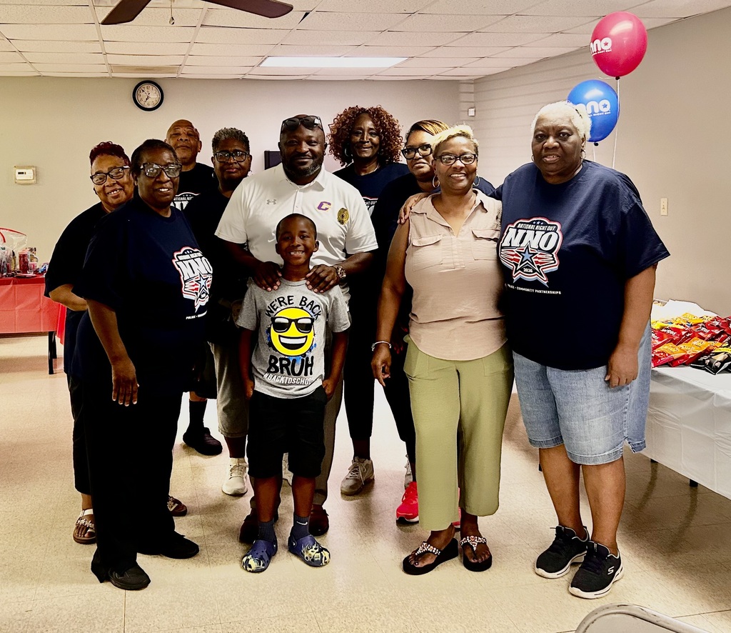 Dr. Chapman and CMSD employees pose for a picture at the recent National Night Out on Crime event held in Columbus.