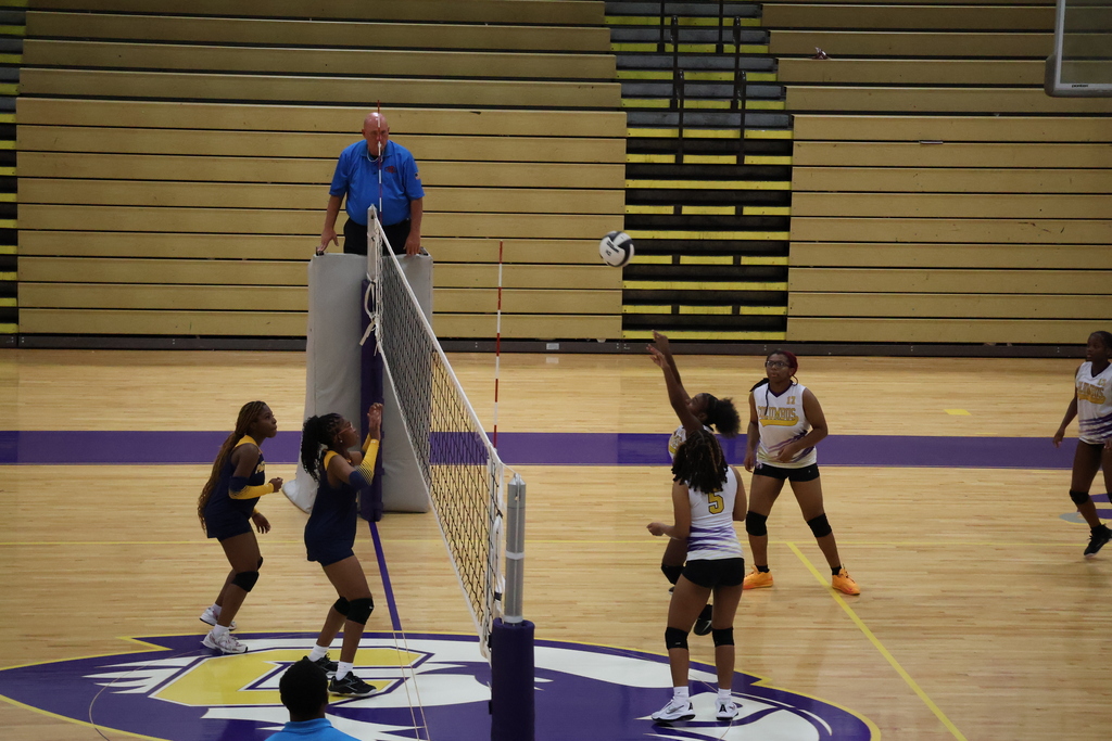 Columbus High volleyball player hits the ball. 