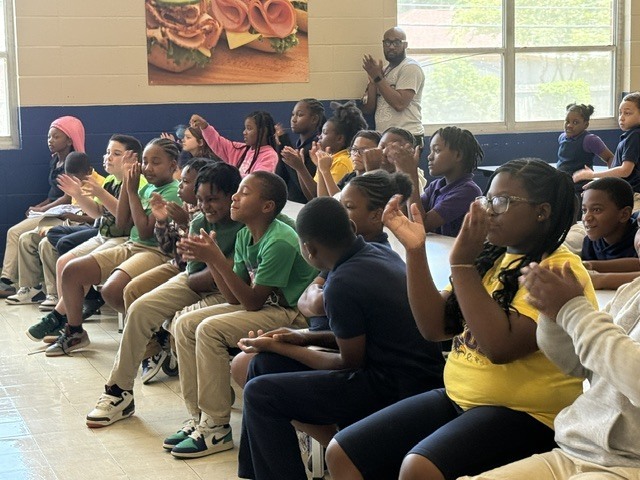 Sale Elementary students clap and participate during a PBIS pep rally at school. 