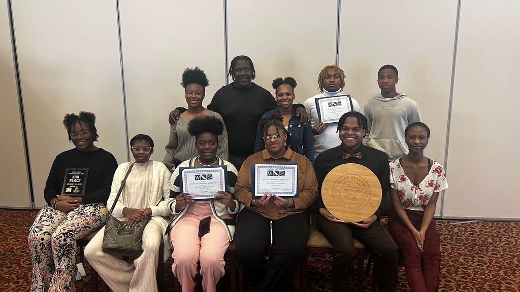 Culinary students proudly show off their awards