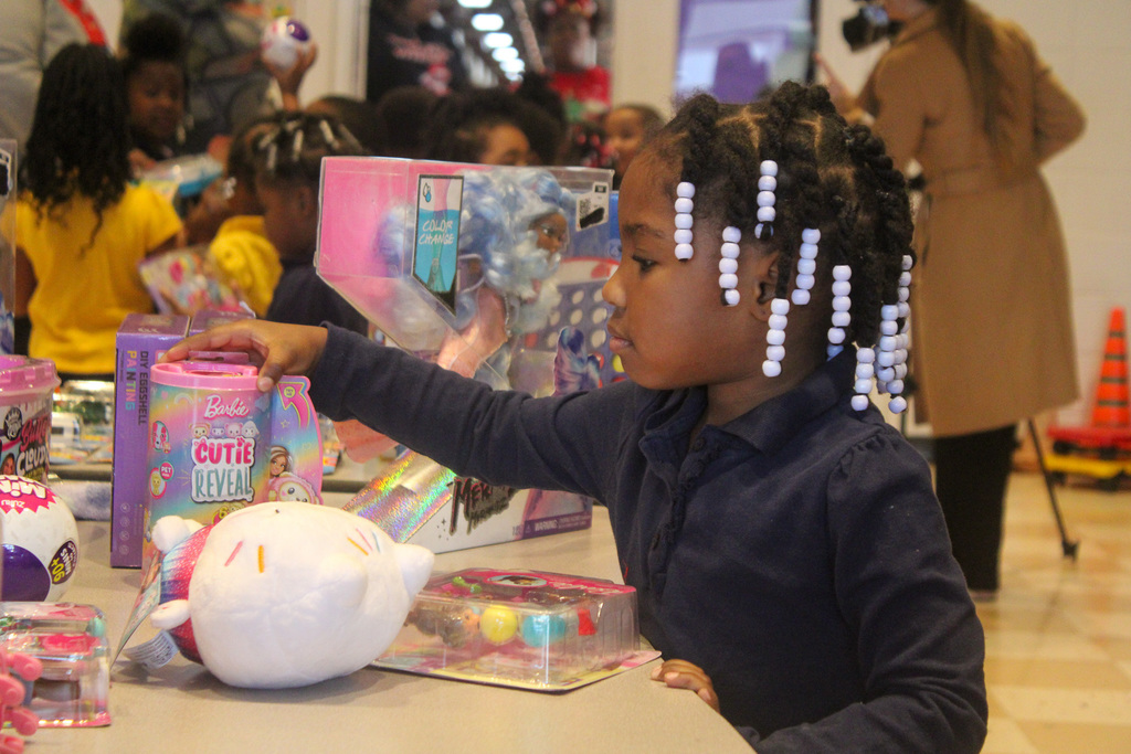 Little girl picking out a present