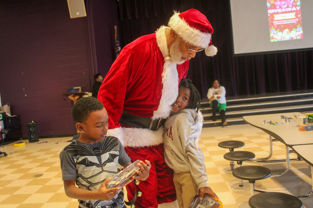 Students thanking santa claus