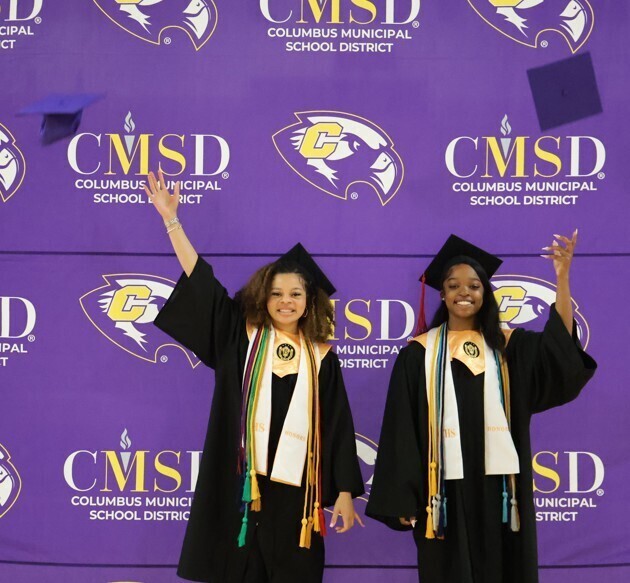 Graduates throw up their hat