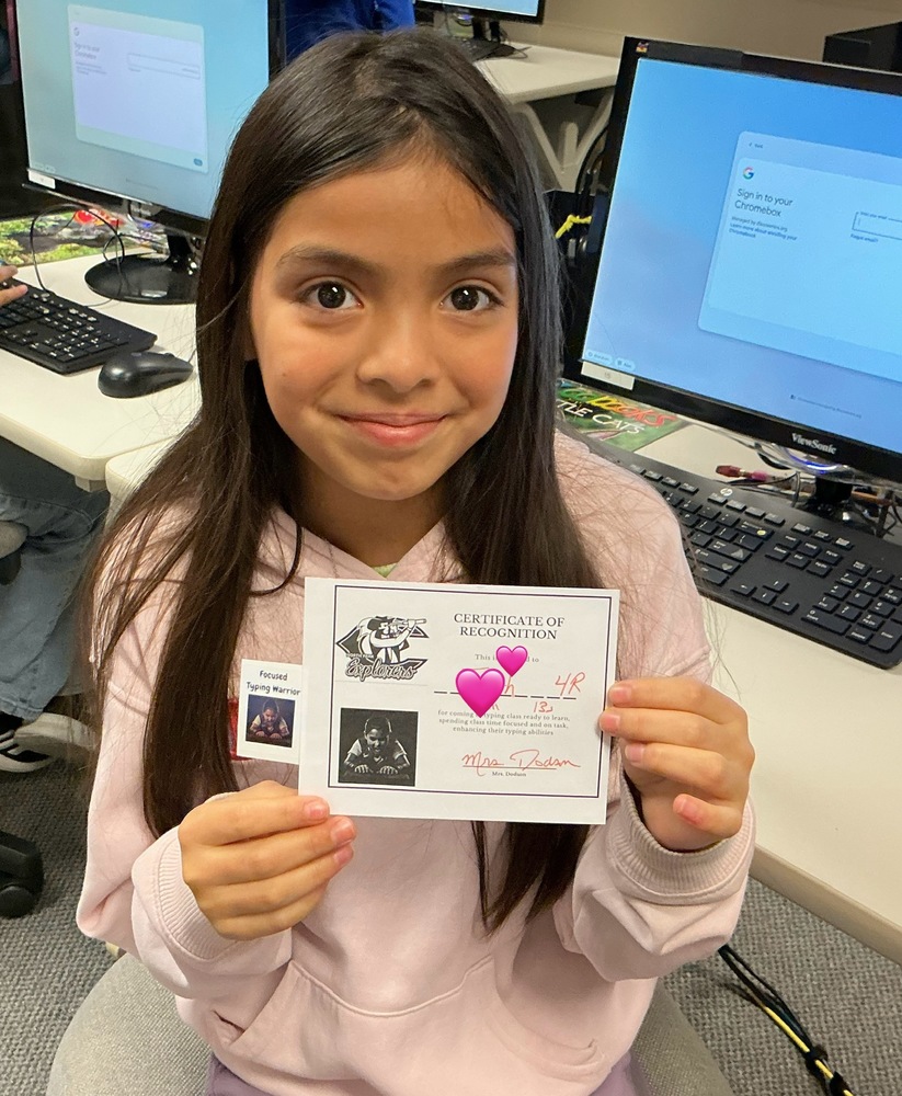 Student holiding certificate